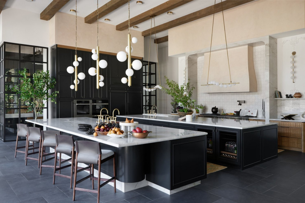 Inspiration for a mid-sized transitional galley enclosed kitchen remodel in Dallas with an undermount sink, shaker cabinets, black cabinets, marble countertops, stainless steel appliances and white backsplash
