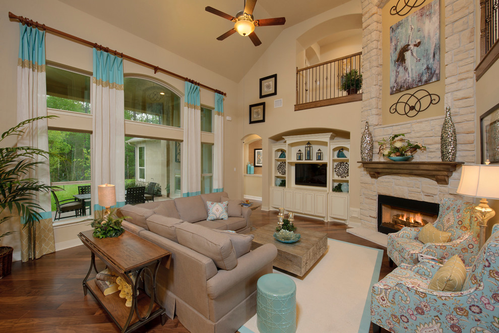 Inspiration for a traditional living room in Houston with a stone fireplace surround.