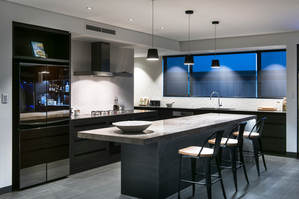 Large modern galley kitchen pantry in Perth with beaded inset cabinets, dark wood cabinets, limestone benchtops and with island.