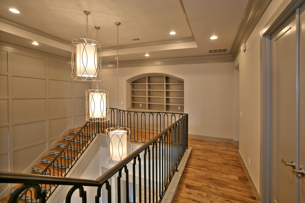 Photo of a mid-sized transitional wood straight staircase in Dallas with tile risers.