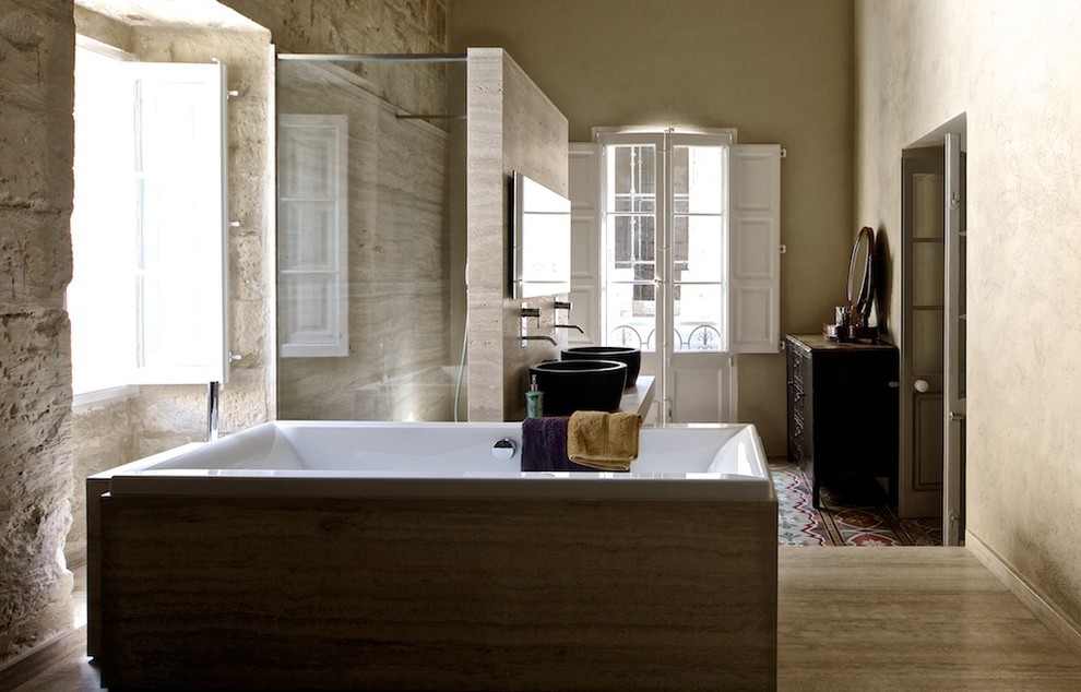 This is an example of a mid-sized eclectic master bathroom with beige cabinets, beige walls and ceramic floors.