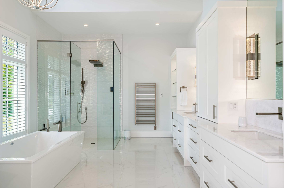 Inspiration for a transitional master bathroom in Toronto with shaker cabinets, white cabinets, a freestanding tub, a curbless shower, white tile, an undermount sink, multi-coloured floor, a hinged shower door, multi-coloured benchtops, a shower seat, a double vanity and a built-in vanity.