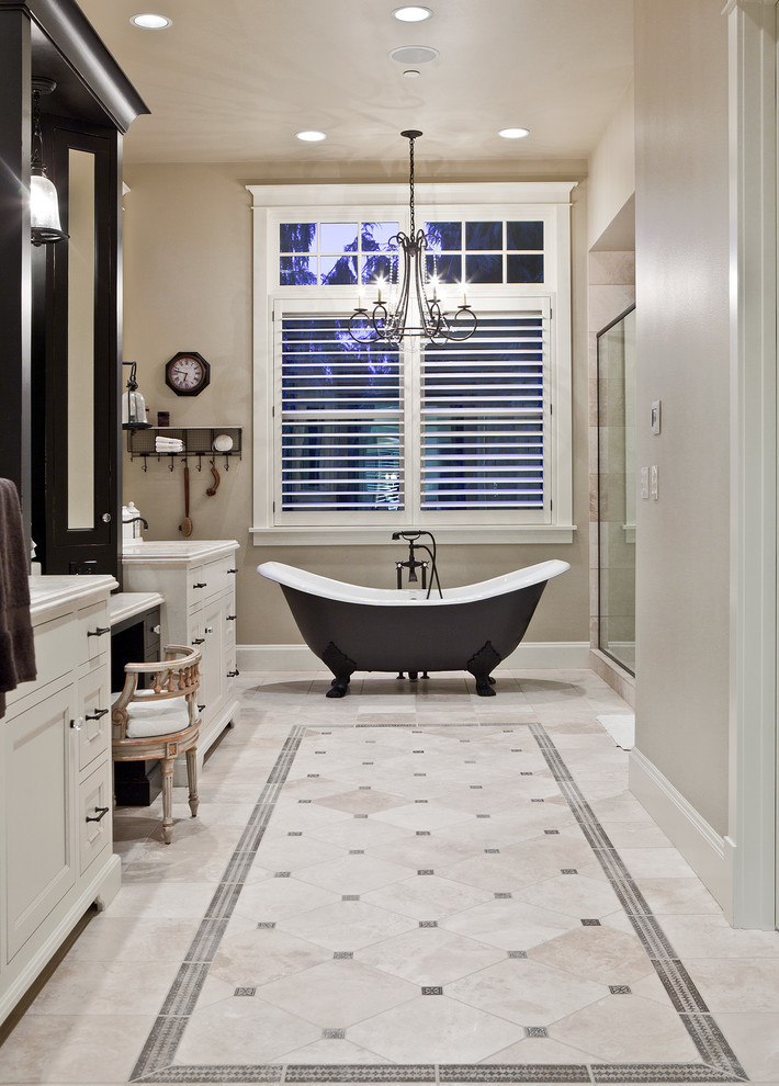 This is an example of a mid-sized traditional master bathroom in Portland with white cabinets, a claw-foot tub, beige walls, an alcove shower, ceramic floors, engineered quartz benchtops and recessed-panel cabinets.