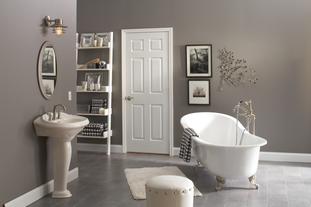 Design ideas for a mid-sized traditional master bathroom in Chicago with a claw-foot tub, gray tile, ceramic tile, grey walls, ceramic floors and a pedestal sink.