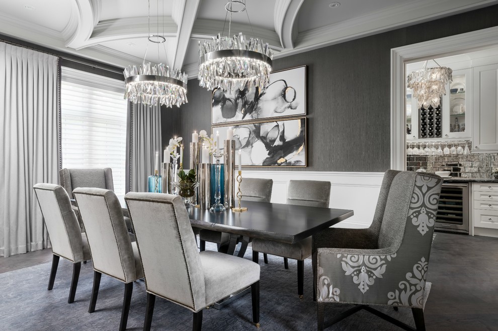 This is an example of a transitional separate dining room in Toronto with grey walls.