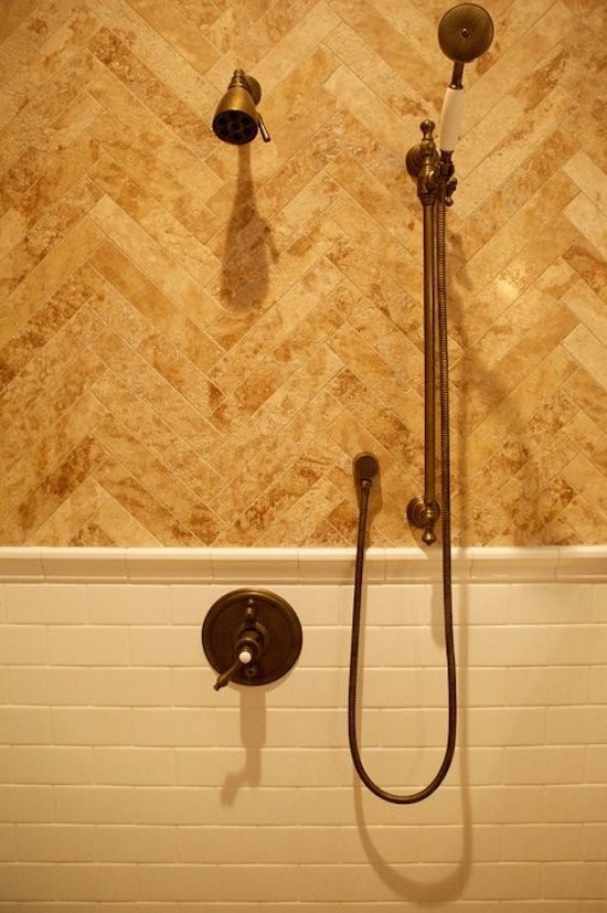 Inspiration for a mid-sized transitional master beige tile and marble tile porcelain tile freestanding bathtub remodel with furniture-like cabinets, medium tone wood cabinets, beige walls and a vessel sink