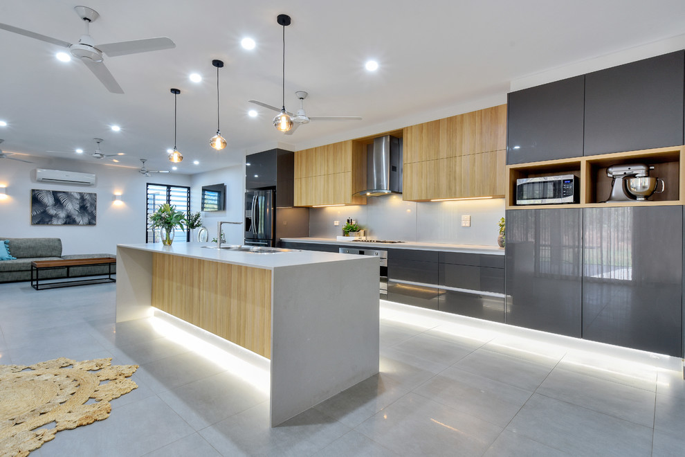Design ideas for a contemporary galley open plan kitchen in Darwin with a drop-in sink, flat-panel cabinets, grey cabinets, grey splashback, with island, grey floor and grey benchtop.