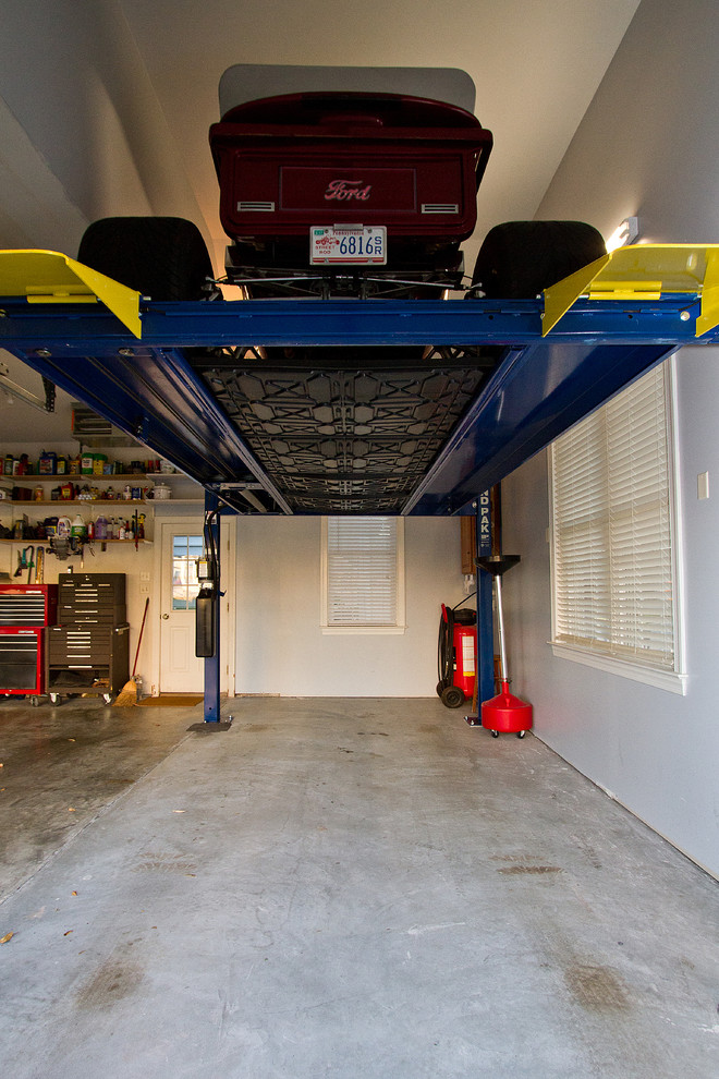 Traditional attached three-car garage in Other.