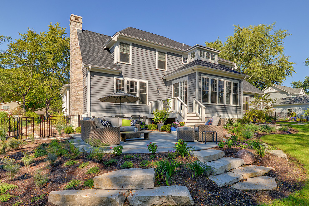 Inspiration for a transitional gray two-story exterior home remodel in Chicago