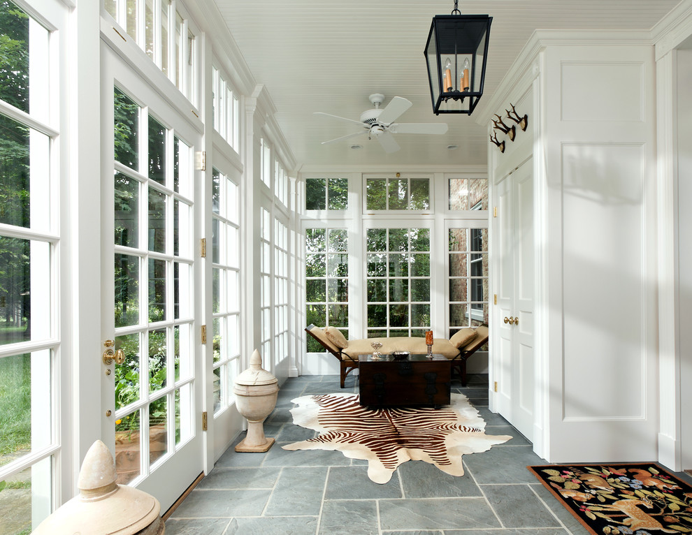 Large traditional sunroom in DC Metro with a standard ceiling, grey floor, slate floors and no fireplace.