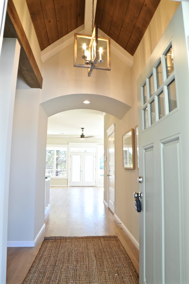 Design ideas for a country foyer in Oklahoma City with grey walls and light hardwood floors.