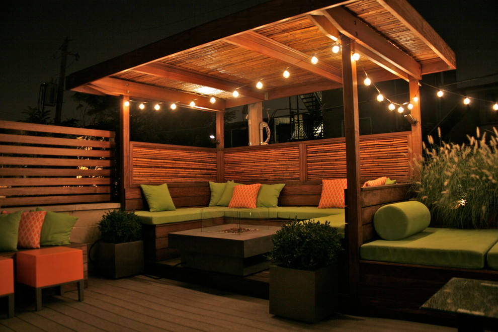 Mid-sized eclectic patio in Chicago with a fire feature, decking and a gazebo/cabana.