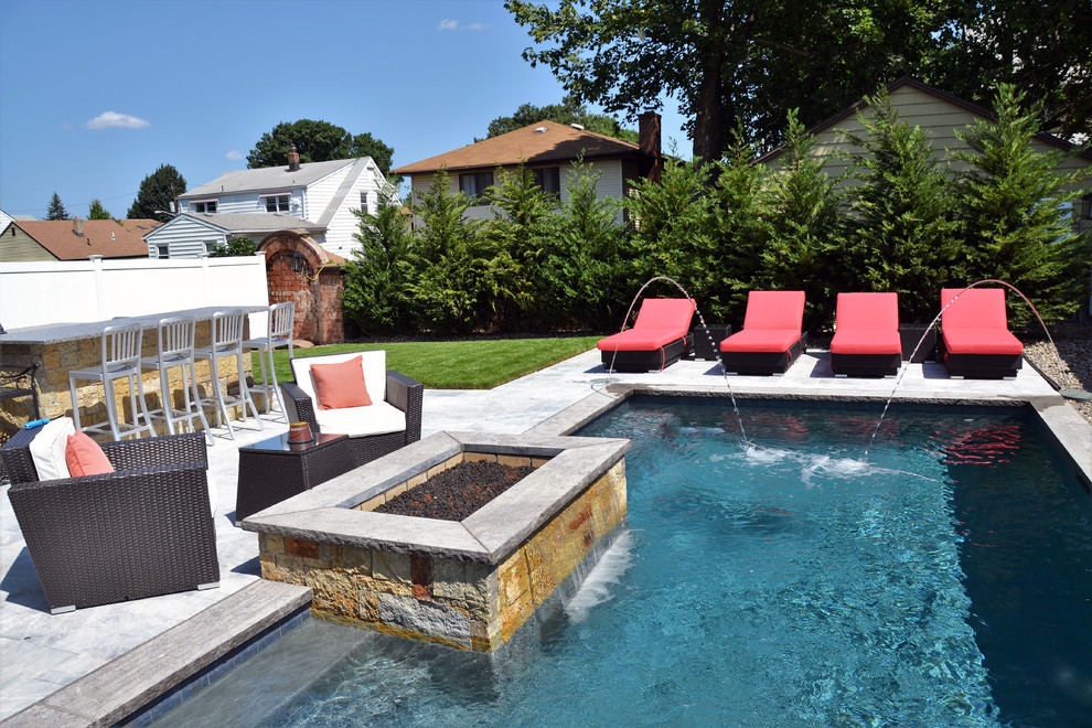Design ideas for a small modern backyard rectangular pool in New York.