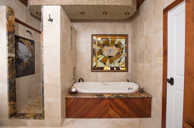This is an example of a mid-sized transitional master bathroom in Other with a drop-in tub, an alcove shower, beige tile, ceramic tile, beige walls, ceramic floors, beige floor and an open shower.