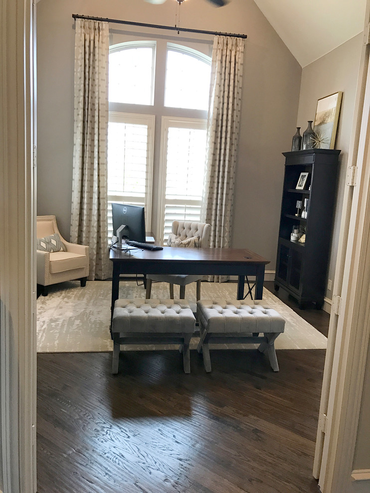 Photo of a small transitional study room in Dallas with grey walls, dark hardwood floors, a freestanding desk and brown floor.