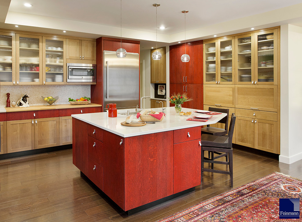 Kitchen - transitional u-shaped medium tone wood floor kitchen idea in Boston with stainless steel appliances, an island, an undermount sink, shaker cabinets, light wood cabinets, quartz countertops, beige backsplash and mosaic tile backsplash