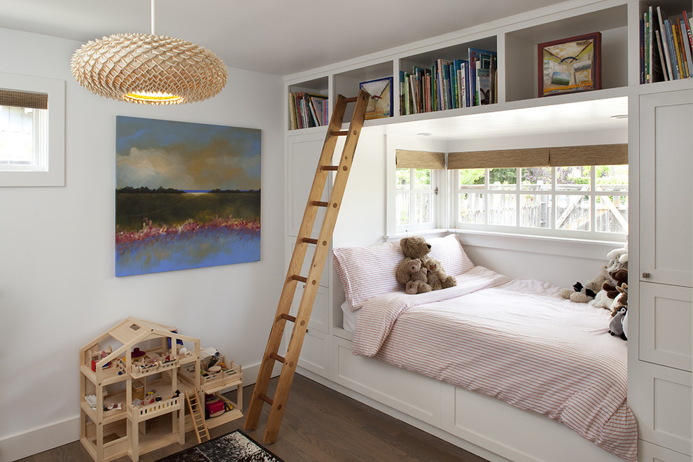 Contemporary gender-neutral kids' bedroom in San Francisco with white walls and dark hardwood floors for kids 4-10 years old.