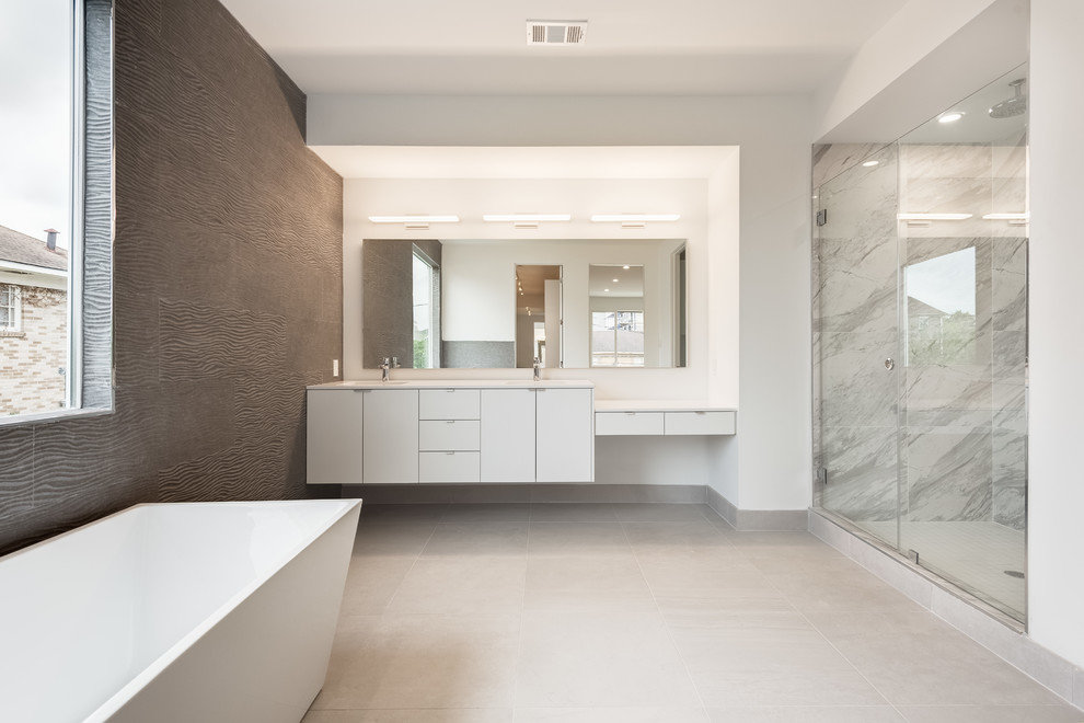 Inspiration for a large contemporary master bathroom in Houston with flat-panel cabinets, white cabinets, a freestanding tub, an alcove shower, gray tile, marble, white walls, concrete floors, an undermount sink, engineered quartz benchtops, grey floor and a hinged shower door.