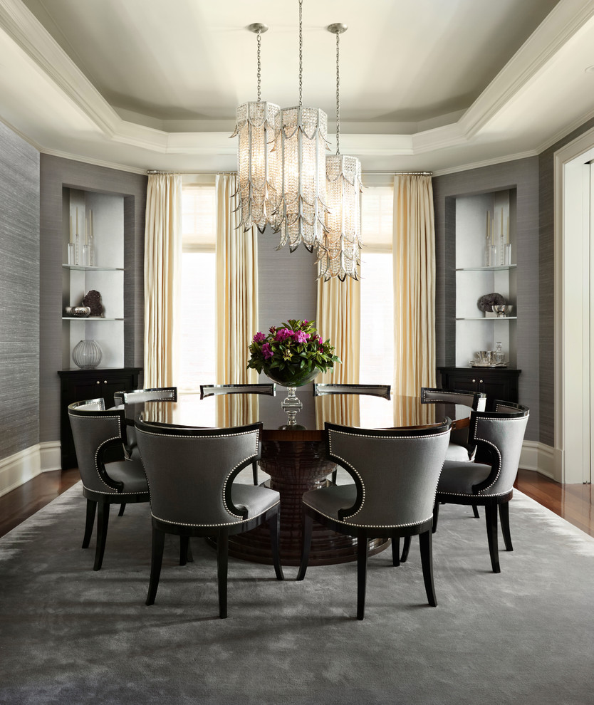 This is an example of a mid-sized transitional separate dining room in New York with grey walls and dark hardwood floors.