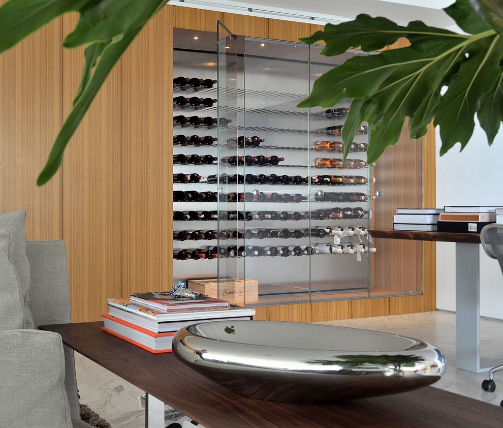 Photo of a large contemporary wine cellar in Other with marble floors, storage racks and grey floor.