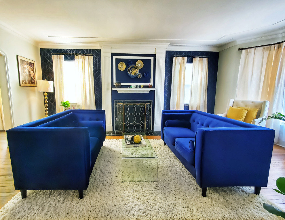 Example of a transitional formal light wood floor, white floor and wallpaper living room design in Detroit with blue walls, a standard fireplace and a stone fireplace