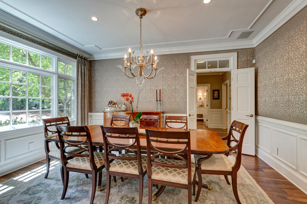 Photo of a large traditional separate dining room in Raleigh with beige walls and dark hardwood floors.
