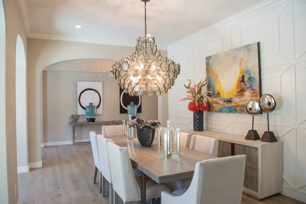 Large transitional separate dining room in Phoenix with white walls and light hardwood floors.