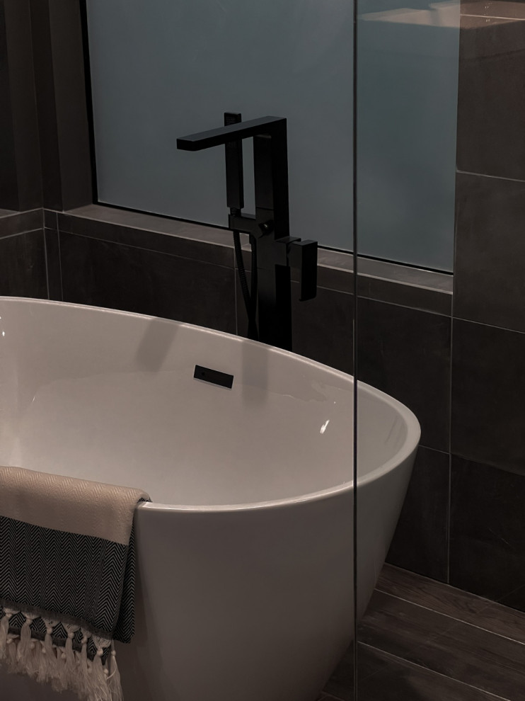 Design ideas for a large modern bathroom in Los Angeles with a freestanding tub, a corner shower and grey walls.