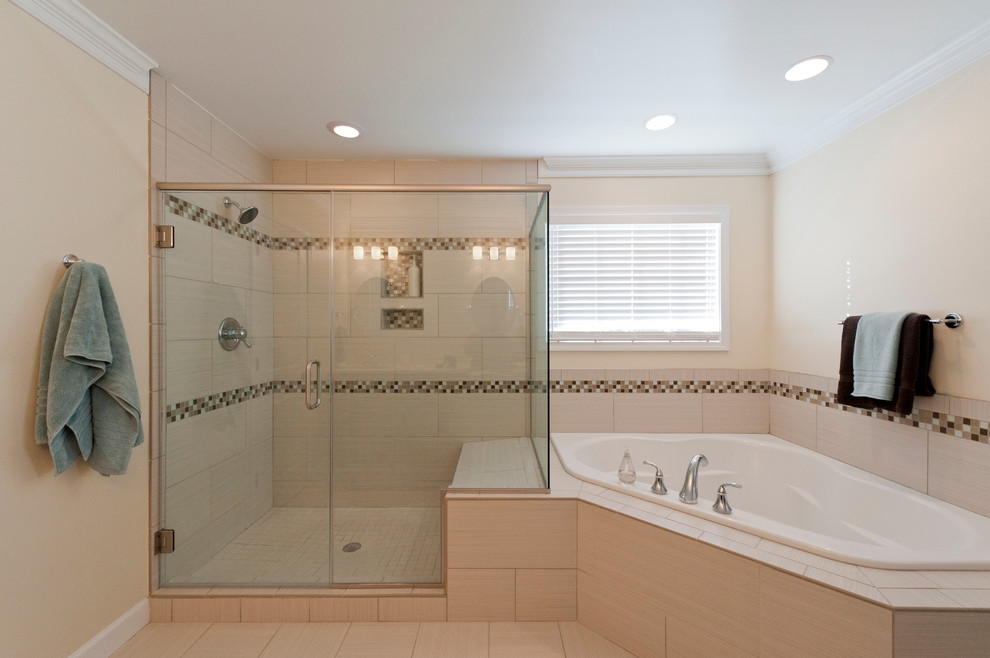 Bathroom - traditional master beige tile and porcelain tile porcelain tile and beige floor bathroom idea in Richmond with raised-panel cabinets, dark wood cabinets, a two-piece toilet, beige walls, an undermount sink, granite countertops and a hinged shower door
