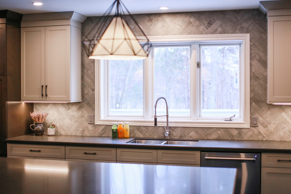 Large transitional l-shaped dark wood floor and brown floor eat-in kitchen photo in Toronto with an undermount sink, shaker cabinets, gray cabinets, quartz countertops, gray backsplash, porcelain backsplash, stainless steel appliances and an island