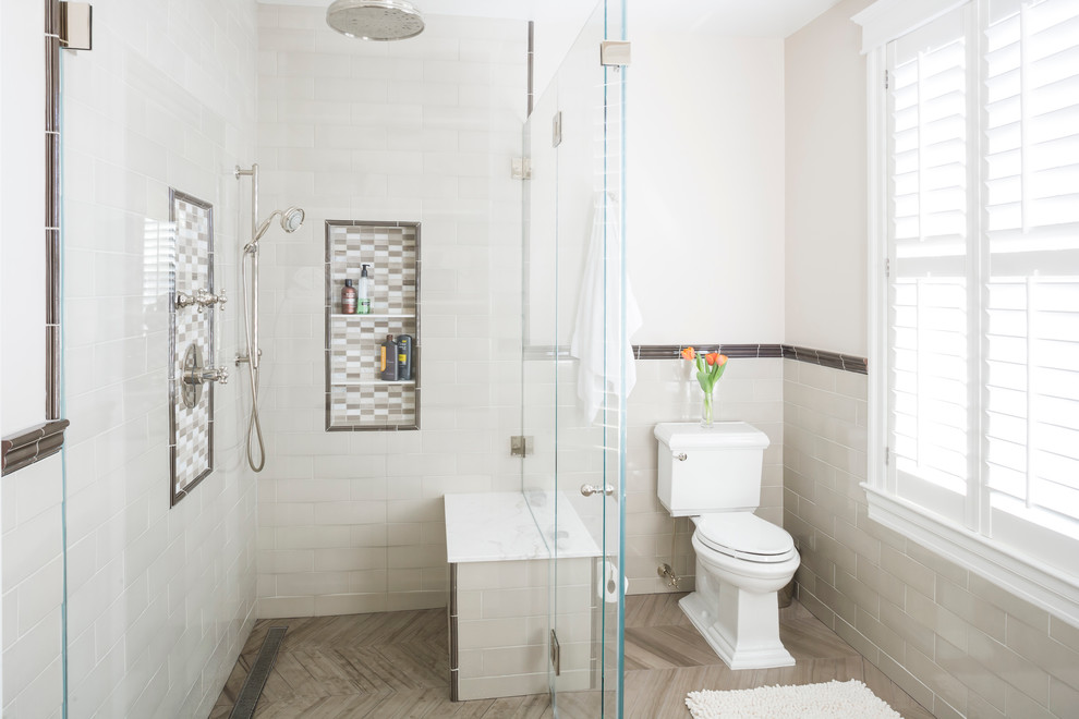 Contemporary bathroom in New York with a curbless shower, a niche and a shower seat.