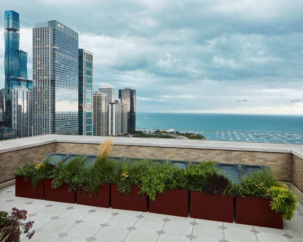 Large minimalist rooftop rooftop metal railing deck container garden photo in Chicago with a pergola