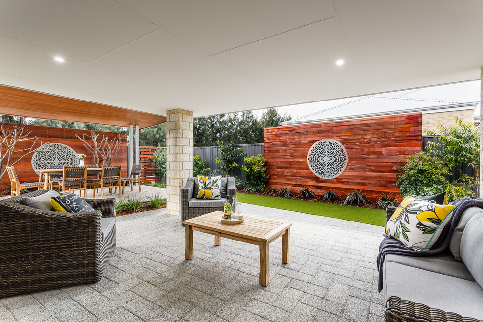 Inspiration for a mid-sized contemporary backyard deck in Perth with a roof extension.