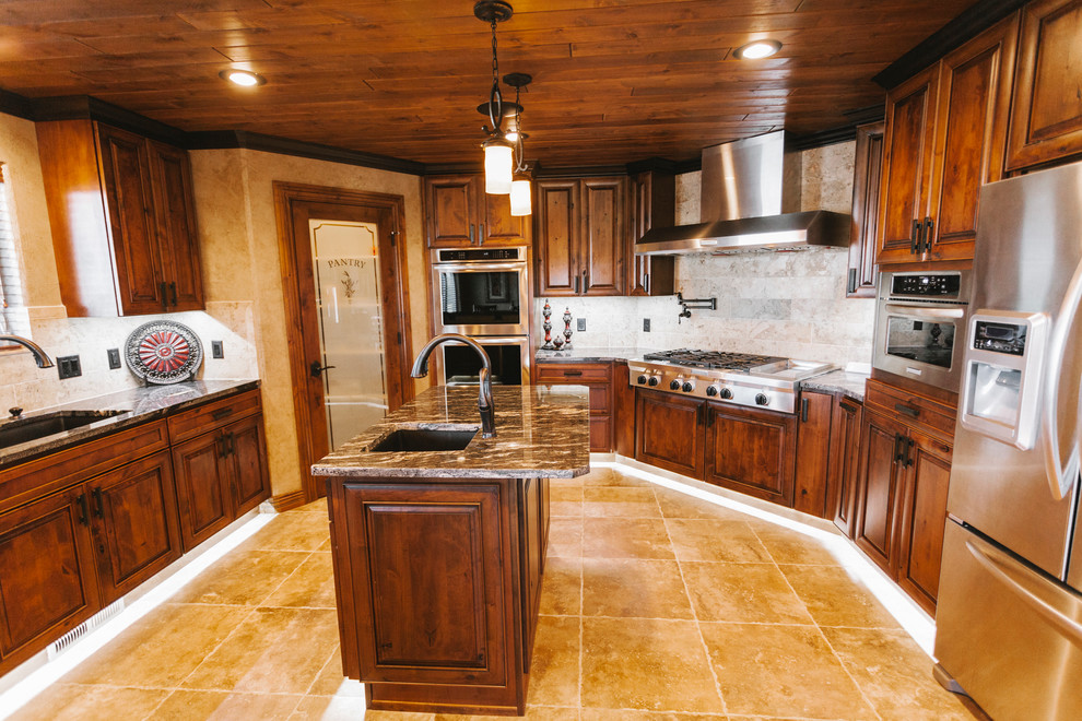Kitchen - transitional kitchen idea with a drop-in sink, dark wood cabinets, quartz countertops, beige backsplash, custom tile backsplash, stainless steel appliances and beige walls