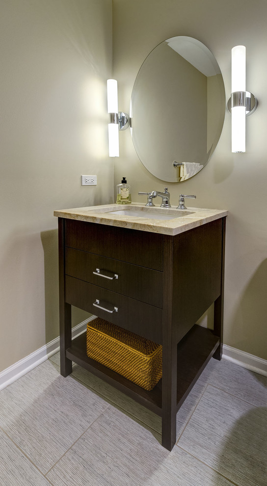 Inspiration for a small transitional powder room in Chicago with flat-panel cabinets, dark wood cabinets, a two-piece toilet, beige walls, porcelain floors, an undermount sink, engineered quartz benchtops, grey floor and beige benchtops.