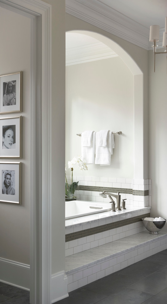 Photo of a large traditional master bathroom in Other with white tile, white walls, an alcove tub and porcelain tile.