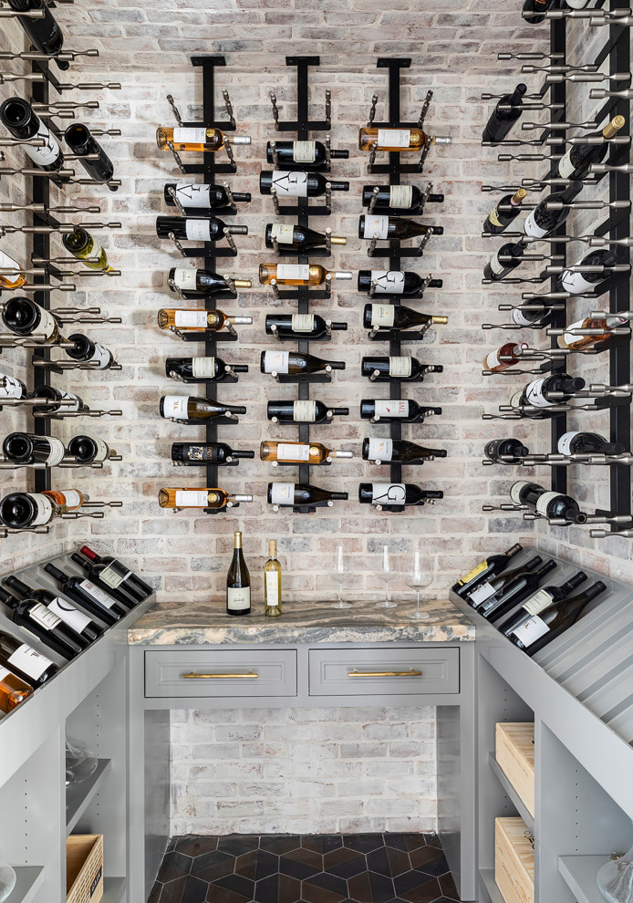 Medium sized wine cellar in Houston with ceramic flooring, display racks and black floors.