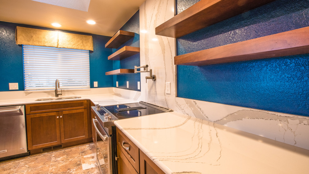 Inspiration for a large transitional l-shaped laminate floor eat-in kitchen remodel in Seattle with an undermount sink, recessed-panel cabinets, dark wood cabinets, quartz countertops, stainless steel appliances and an island