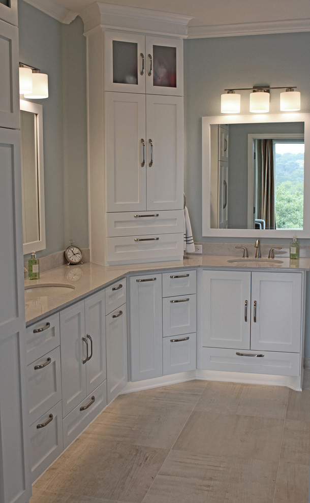 Drop-in bathtub - large transitional master beige tile and porcelain tile porcelain tile and beige floor drop-in bathtub idea in Austin with shaker cabinets, white cabinets, quartz countertops, an undermount sink, blue walls, beige countertops, a hinged shower door and a two-piece toilet