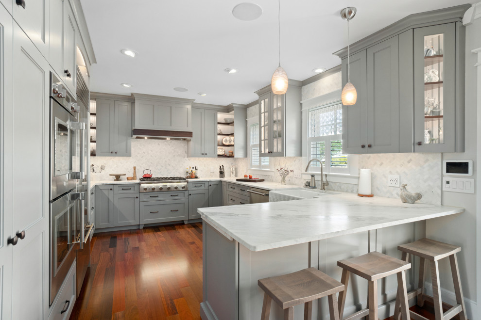 Large beach style u-shaped kitchen photo in Providence with shaker cabinets, gray cabinets, quartzite countertops, multicolored backsplash, marble backsplash, stainless steel appliances, a peninsula and multicolored countertops