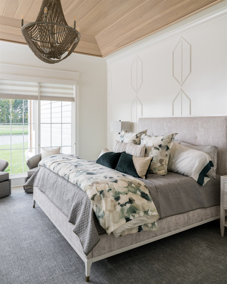 This is an example of a mid-sized beach style master bedroom in Indianapolis with white walls, medium hardwood floors and no fireplace.
