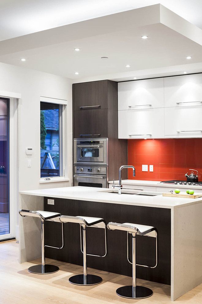 Contemporary kitchen in Vancouver with stainless steel appliances.