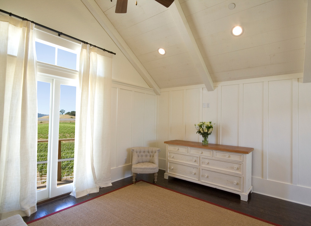 Design ideas for a mid-sized country guest bedroom in San Francisco with white walls and dark hardwood floors.