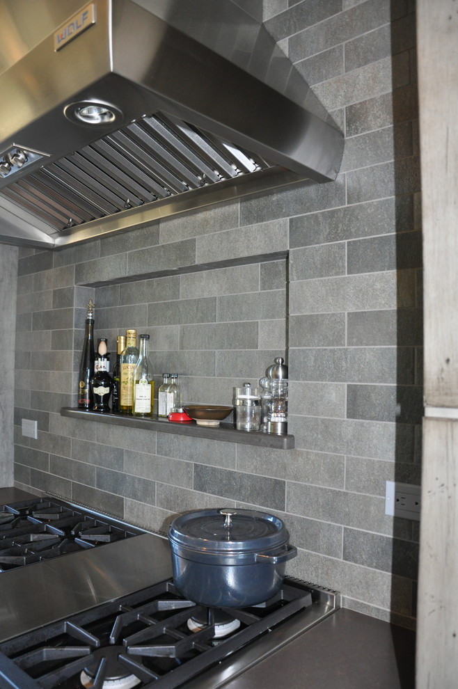Eat-in kitchen - large rustic l-shaped eat-in kitchen idea in Seattle with shaker cabinets, distressed cabinets, quartz countertops, gray backsplash, stone tile backsplash and stainless steel appliances