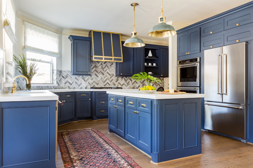 Inspiration for a transitional kitchen in Houston with a single-bowl sink, recessed-panel cabinets, blue cabinets, multi-coloured splashback, stainless steel appliances, medium hardwood floors and with island.