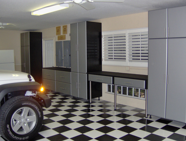 Garage storage and built in work desk with cabinets traditional-car-porch