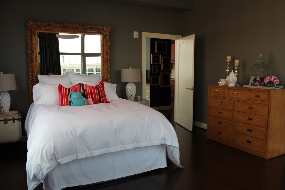 Design ideas for a mid-sized eclectic master bedroom in St Louis with brown walls and medium hardwood floors.