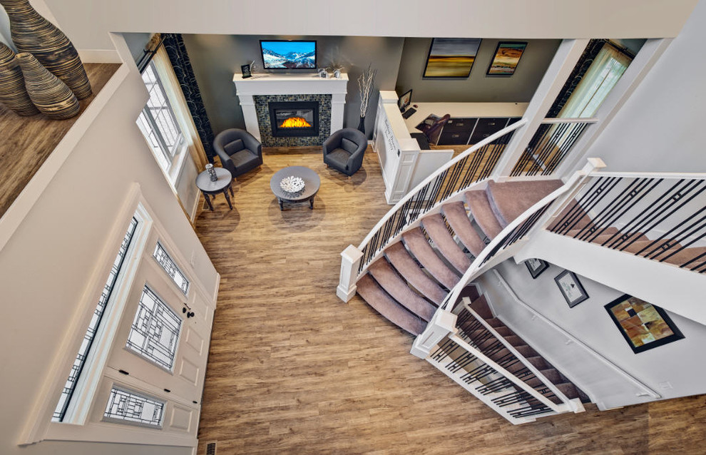 Large traditional foyer in Toronto with grey walls, light hardwood floors, a single front door and a glass front door.