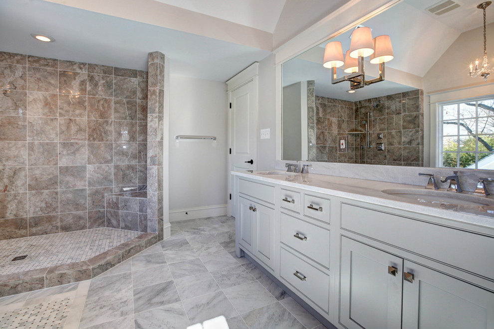 Photo of a mid-sized arts and crafts master bathroom in DC Metro with an undermount sink, beaded inset cabinets, grey cabinets, quartzite benchtops, a claw-foot tub, a corner shower, a two-piece toilet, gray tile, glass tile, grey walls and medium hardwood floors.
