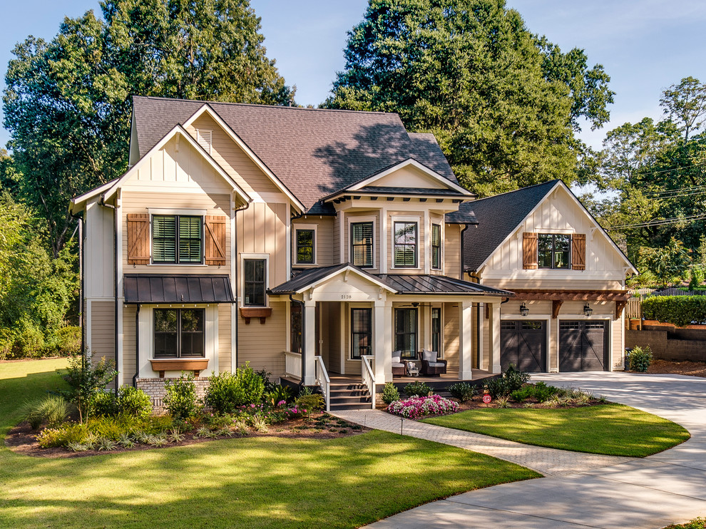 Inspiration for a traditional two-storey beige exterior in Charlotte with a mixed roof.